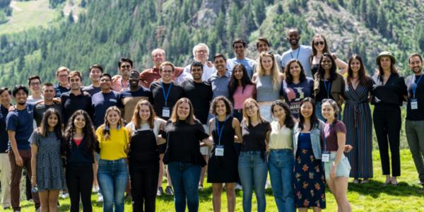 Group picture of 22 selected students with a mountain backdrop 