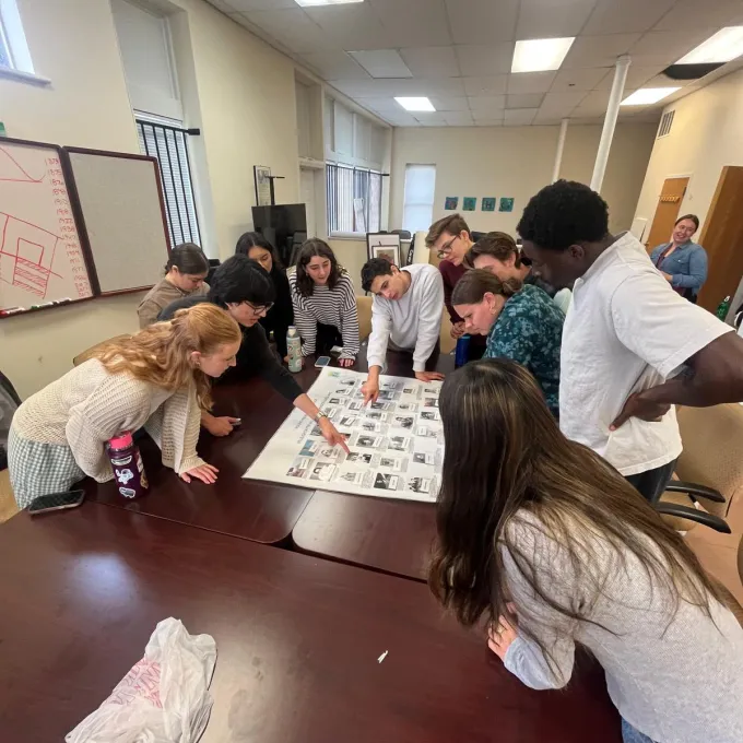 "gcp students around a table working on a activity while in the 4TheVille office"